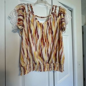 Cold shoulder blouse.